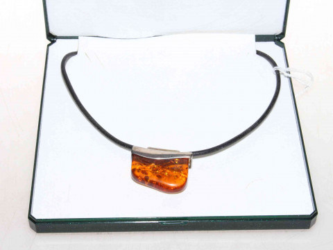 Silver mounted amber pendant, boxed