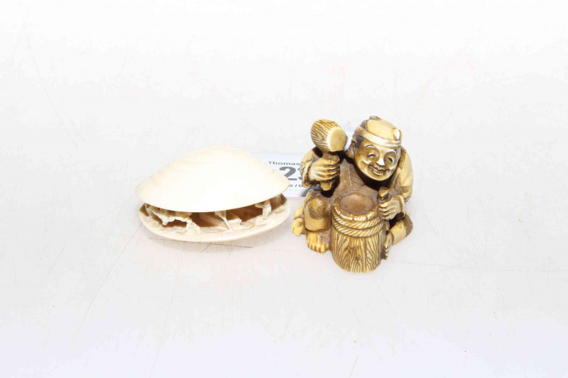 Two ivory netsuke, one an open shell carving
