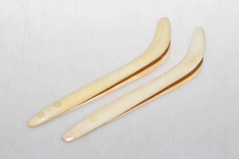Two pair of antique ivory nippers