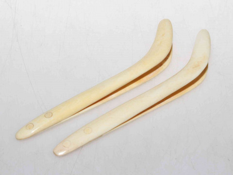 Two pair of antique ivory nippers