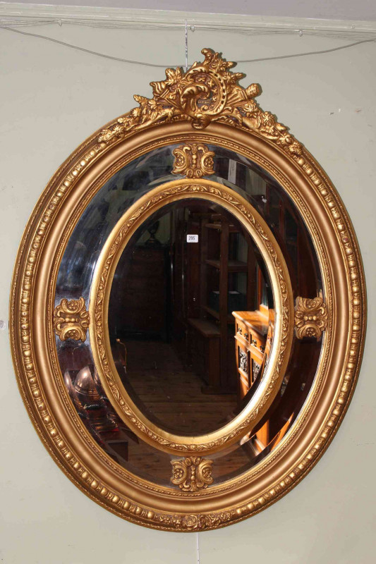 Good gilt framed oval wall mirror, 138cm by 105cm overall
