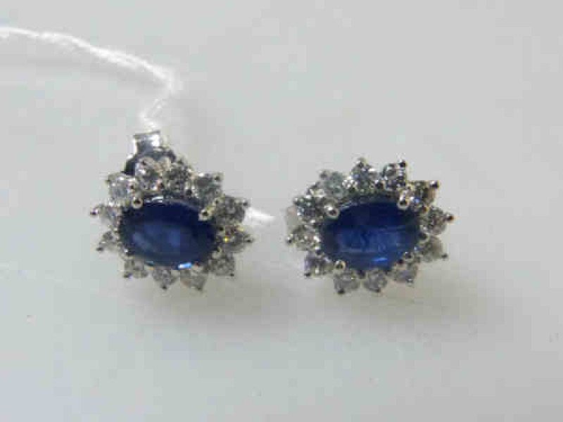Pair of Sapphire and Diamond Cluster Earrings, the Sapphires Approximately 2.06 Carats Gross and the Diamonds 0.86 Carats Gross, Mounted on 18ct White Gold