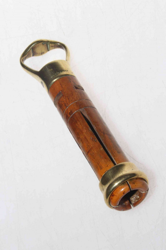 Wood and brass snooker cue cleaner, bearing registration no. 658060.