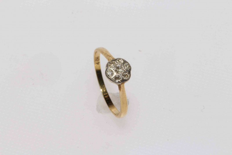 18 carat seven stone diamond cluster ring.