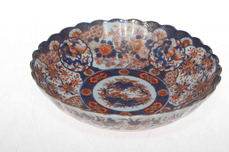 19th Century Imari bowl of fluted circular form and with profuse decoration, underglaze blue mark, 25.5cm diameter.