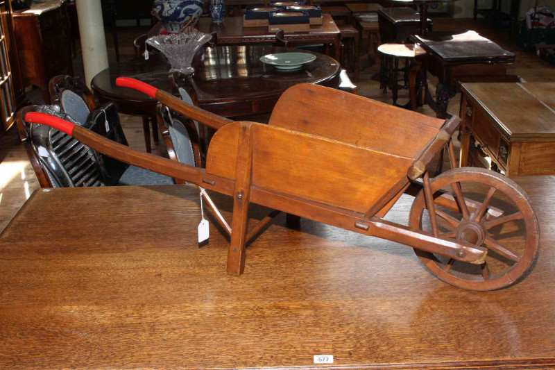 Vintage wooden child's/apprentice garden wheelbarrow, overall length 42cm.