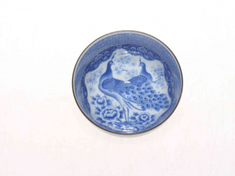 Oriental porcelain tea bowl, with fine interior blue and white decoration...
