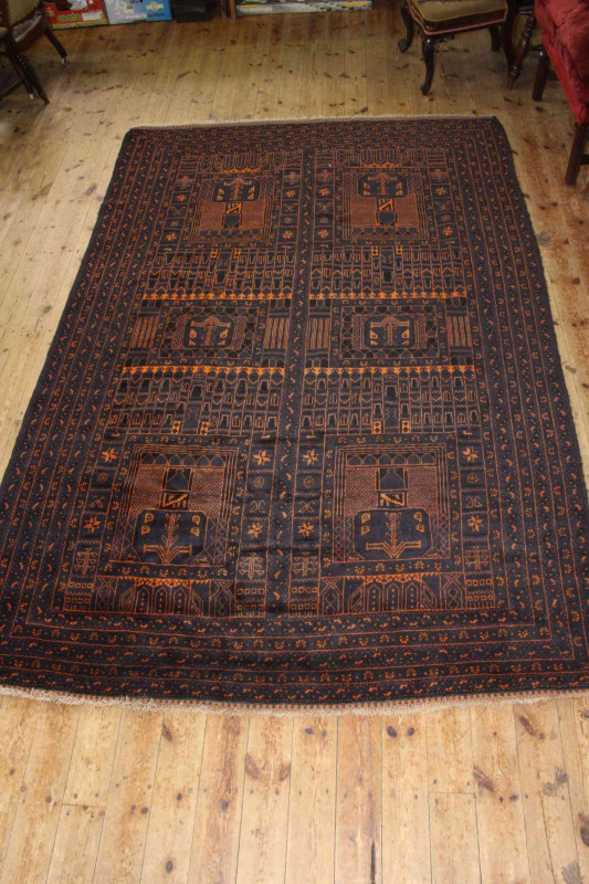Persian design rug with a black ground 2.85 by 1.85.