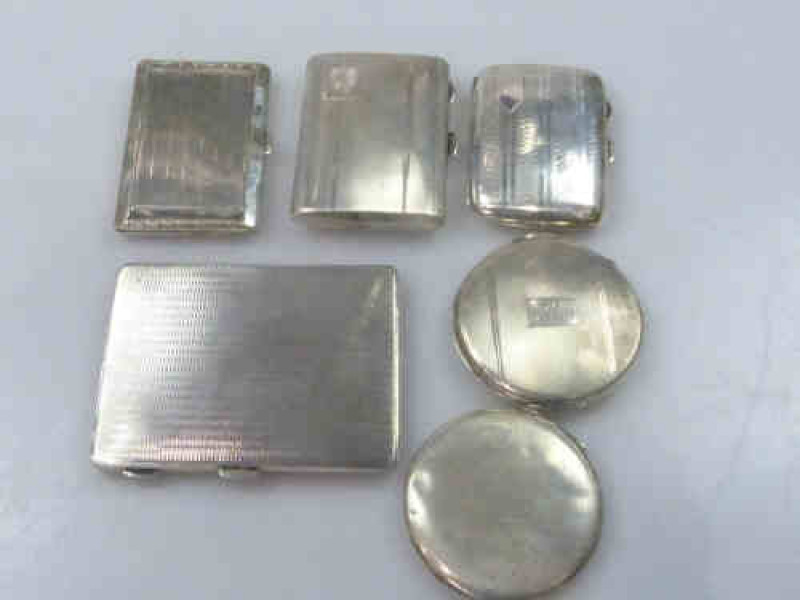 Three Silver Cigarette Cases, Two Silver Compacts and an Enamel and Silver Plated Cigarette Case (6) Approximately 12 Troy ozs gross of silver