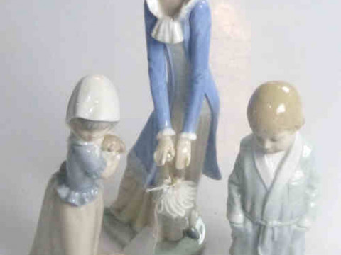 Lladro Figure 'Boy in Dressing Gown' and Two Nao Figures