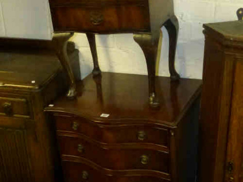 Serpentine Front Mahogany Four Drawer Chest on bracket feet and Serpentine...