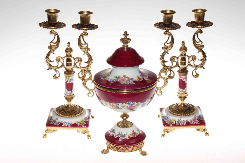 Three piece Italian pottery and gilt metal garniture.