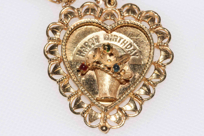 14 carat gold 'Happy Birthday' heart shaped pendant with 9 carat gold chain.