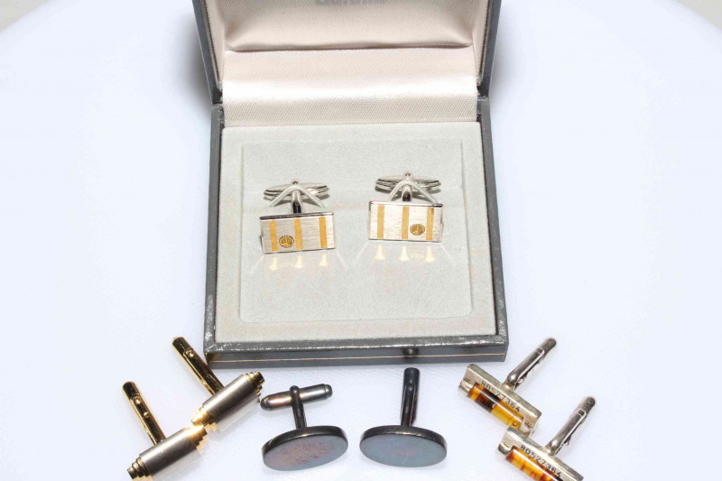 Four pairs of cufflinks including silver and amber.
