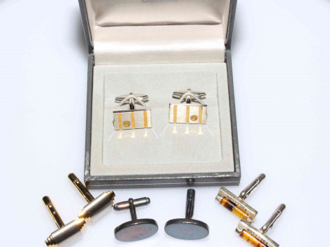 Four pairs of cufflinks including silver and amber.