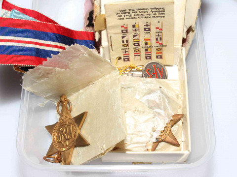WWII medals with ribbons, silver and enamel AFS badge 114437 with military...