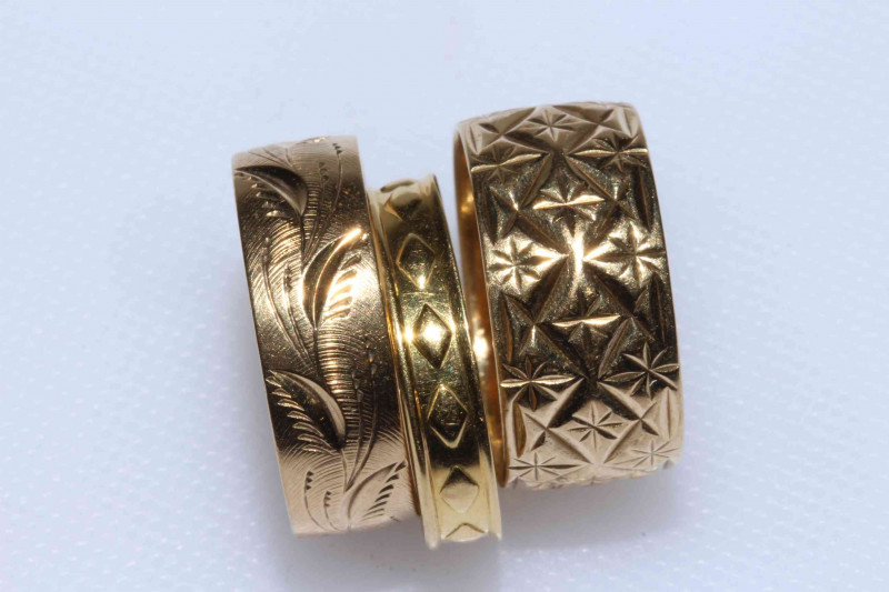 Two 9 carat and one 18 carat gold band rings.