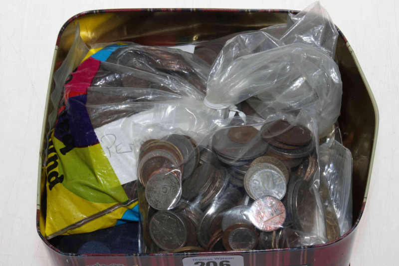 Tin with coins and medals.