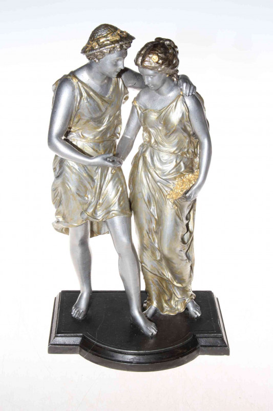 19th Century well detailed French figural metal group of a standing classical romantic couple on a bronzed metal base, 29cm.