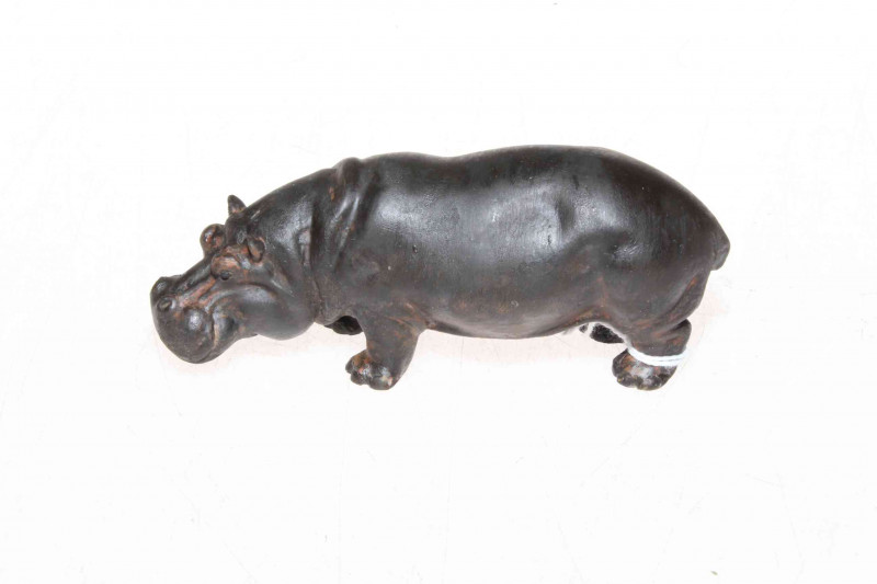 A well detailed early 20th Century cold painted bronze hippopotamus standing four square with lowered head, probably Austrian, 11cm.