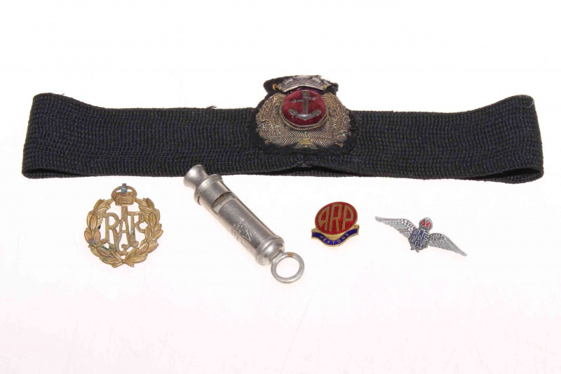 Military badges and ARP whistle.
