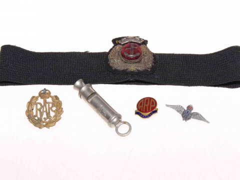 Military badges and ARP whistle.