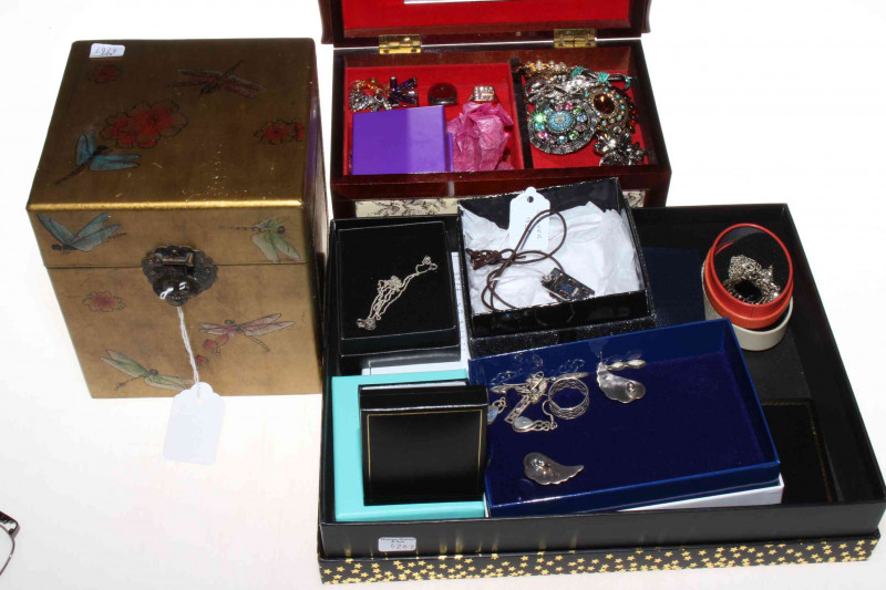 Three boxes of silver and costume jewellery.