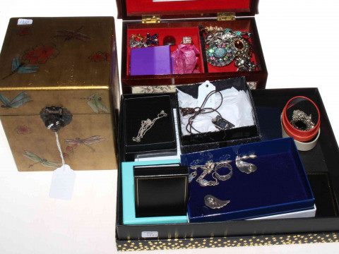 Three boxes of silver and costume jewellery.