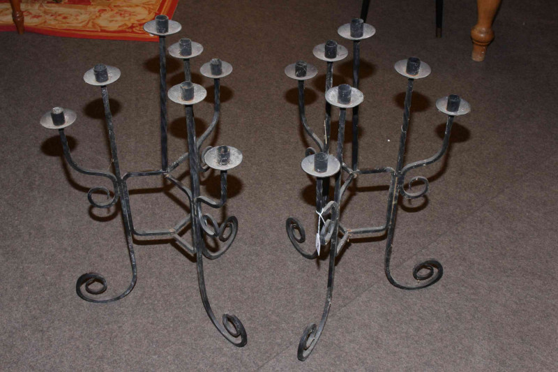 Two flame throwers, novelty life buoy, pair iron candle stands and two tennis racquets (7).