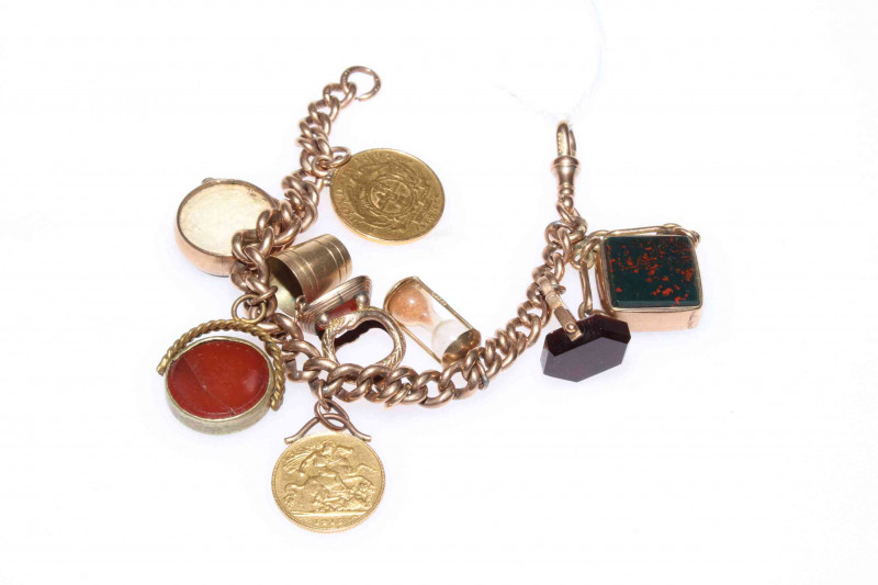 9ct gold charm bracelet with coins and hardstone fobs, 63g gross