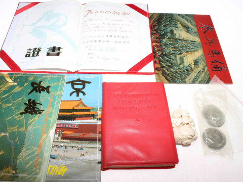 Seven 1960's half dollar coins, small carving and Chinese booklets