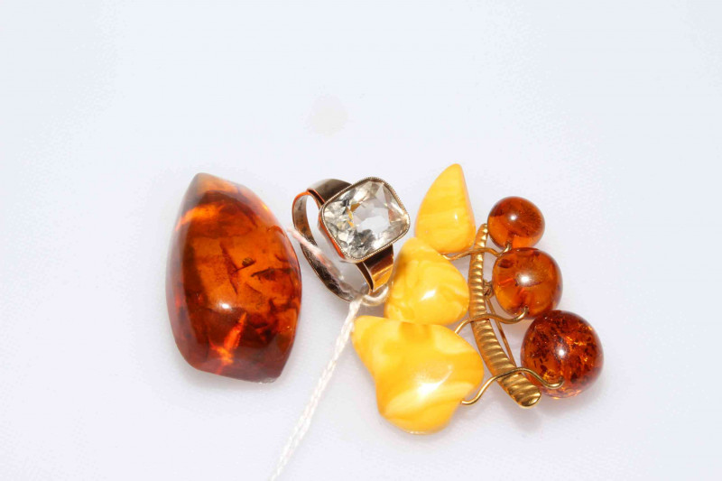 Ring and two amber brooches (3)