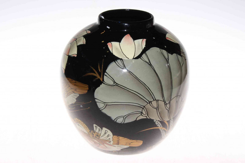 Bulbous vase with oriental bird and foliate decoration on black ground, 22cm