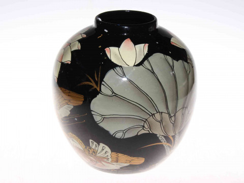 Bulbous vase with oriental bird and foliate decoration on black ground,...