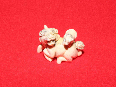 Antique ivory netsuke of beast with cub