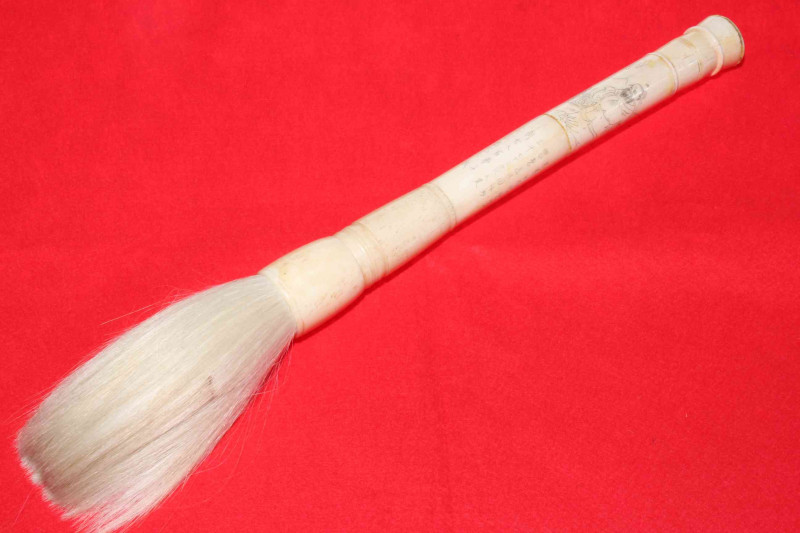 Chinese ivory/bone handled fly whisk, having engraved figure and calligraphy, 44cm length