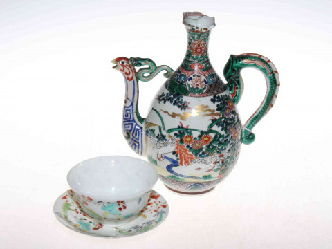Chinese polychrome tea bowl and saucer and a ewer (2)