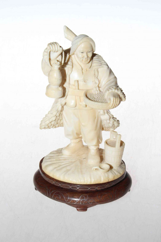 Antique ivory figure of china man with lamp and basket, 19cm