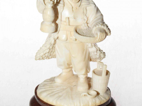 Antique ivory figure of china man with lamp and basket, 19cm