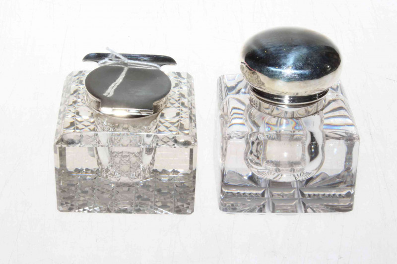 Two heavy silver topped glass desk inkwells, London 1895 and Birmingham 1913