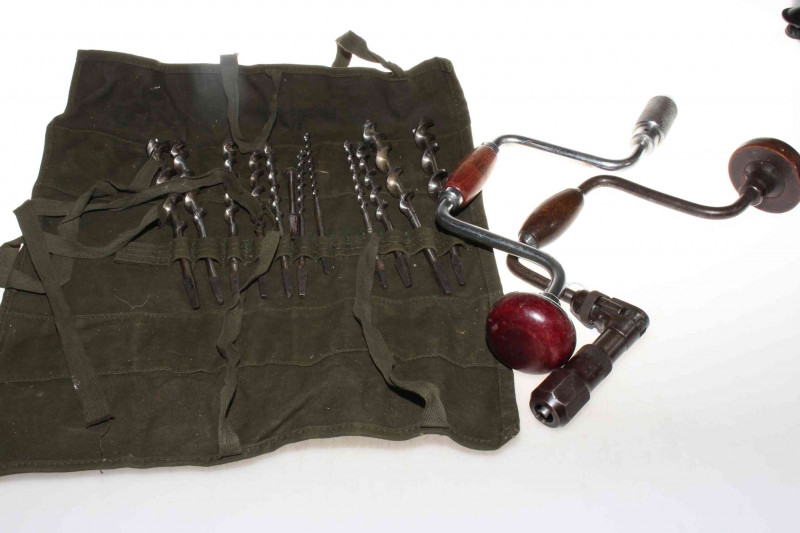 Twelve piece drill bit set in canvas roll together with drill braces