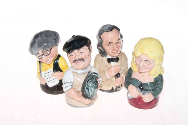 Four Royal Doulton candle snuffers 